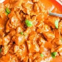 Butter Chicken · Marinated chicken cooked with specially made delicious creamy sauce. Served with naan or rice.