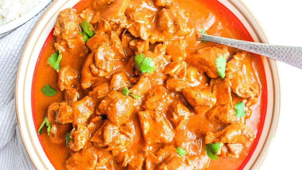 Butter Chicken · Marinated chicken cooked with specially made delicious creamy sauce. Served with naan or rice.