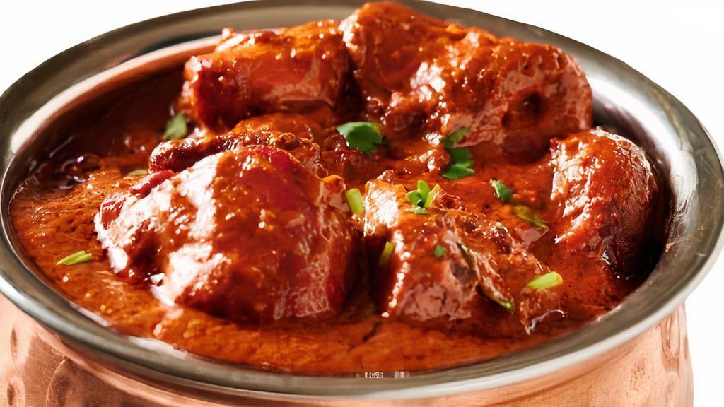 Chicken Tikka Masala · Chicken tikka cooked with specialty made delicious thick sauce. Served with naan or rice.