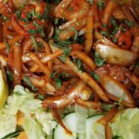 Tandoori Mixed Grill · A combination of tikka, tandoori chicken, shrimp, sheek kabab, and boti kabab. Served with n...