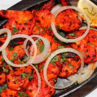 Shrimp Tandoori · Shrimp marinated in homemade curd with herbs and mild spices then cooked in clay oven.  Serv...