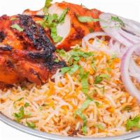 Tandoori Chicken Biryani · Boneless tandoori chicken cooked with aromatic spices and flavorful basmati rice.