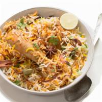 Chicken Biryani · Chicken cooked with aromatic spices and flavorful basmati rice.