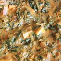 Palak Paneer · Spinach and home style cheese cooked in creamy sauce. Served with rice or naan