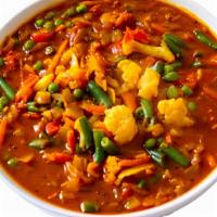 Mixed Vegetable Curry · Mixed vegetables cooked in mild spiced gravy. Served with rice or naan
