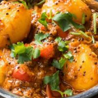 Bombay Aloo · Potatoes cooked with curry sauce.