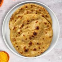 Knock On Tandoori Roti · Whole wheat Indian bread cooked in a clay oven.