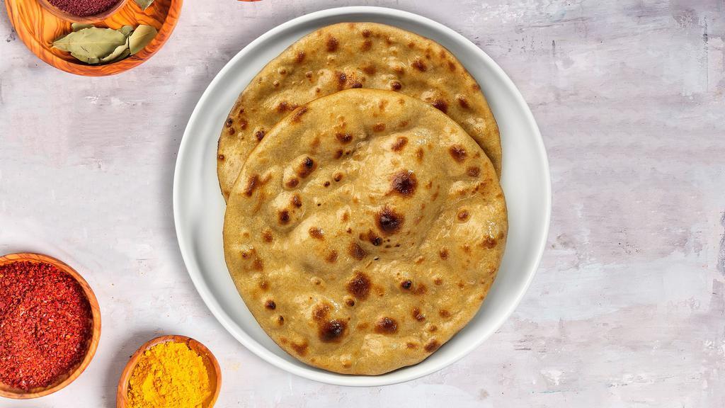 Knock On Tandoori Roti · Whole wheat Indian bread cooked in a clay oven.