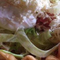 Chicken Salad · Crispy tortilla shell filled with grilled chicken cooked with onions, along with lettuce, to...