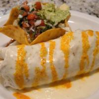 Burrito Marino · Burrito filled with shrimp, grilled onions, peppers and tomatoes. Served with rice and a cri...