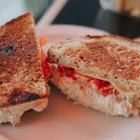 Mimi'S Melody · Tuna salad, Vermont white cheddar, tomato, Russian dressing, grilled on rye (1/4 lb). Includ...