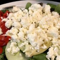 Greek Salad Side · Tomato, cucumber, red onion, kalamata olives, and feta cheese all tossed in our house-made d...