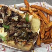 Philly Cheesesteak · French bread, steak, green pepper, onion, mushroom, mozeralla cheese.