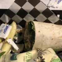 The Italian Wrap · New. Served with a side of your choice and our classic pickle spear. Tortilla stuffed with h...