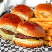 Mini Burgers · Four mini burgers with American cheese and pickles served with our homemade chips.