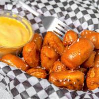 Pretzel Hoses · A basket filled with warm pretzel bites, lightly salted accompanied by warm beer cheese for ...