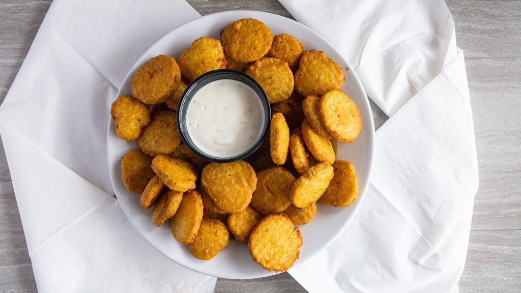 Pickle Chips · Dill Pickle Chips lightly breaded and fried.  Served with spicy ranch sauce for dipping.