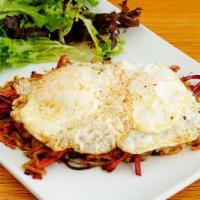 Corned Beef Hash · Shredded brisket, crispy hash browns, caramelized onions, and fried egg. *Served raw or unde...