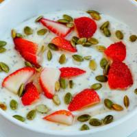 Chia Seed Pudding · A blend of vanilla Greek yogurt and chia seeds topped with fresh strawberries, pumpkin seeds...