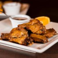 Peek Gai Tod · Lightly battered chicken wings. Deep-fried until crispy brown. Served with Thai sweet chili ...