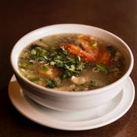 Tom Yum Gai · A tart and spicy chicken soup with galangal, kaffir lime leaves, lemongrass, mushrooms and l...