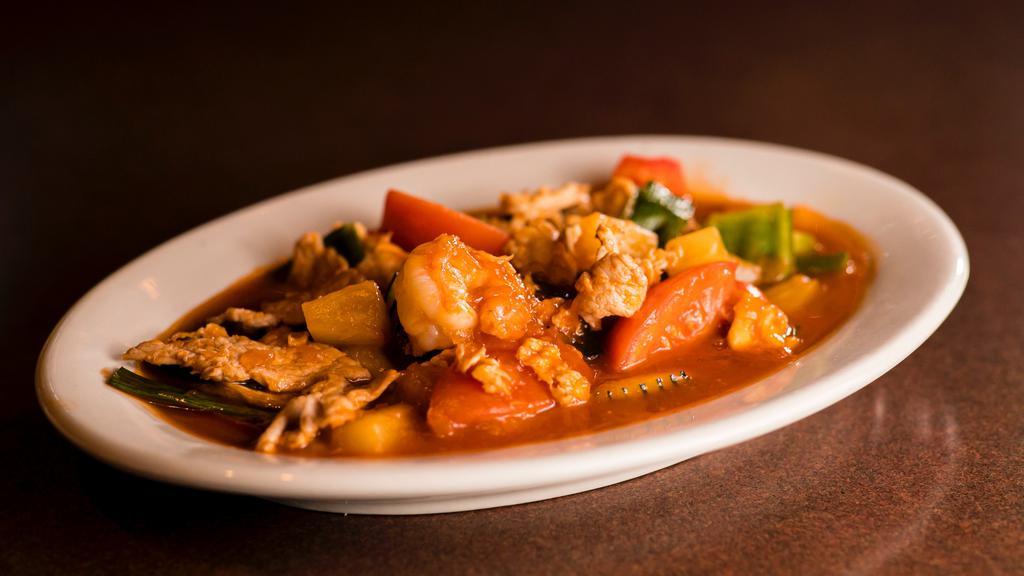 Gang Dang · Choice of meat cooked in red curry paste, coconut milk, with carrots green peas, bamboo shoots, bell peppers, green beans and sweet basil