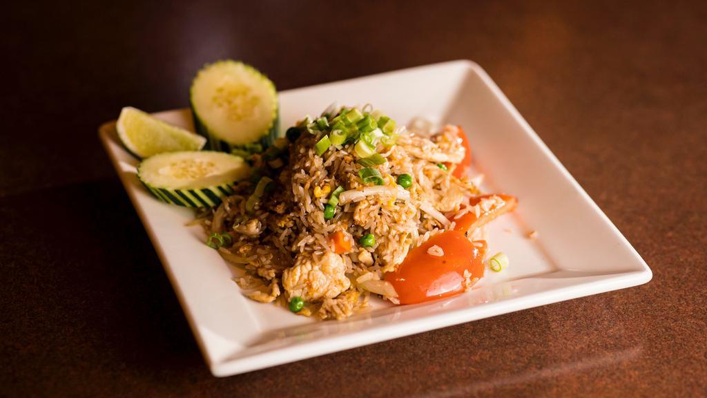 Lanna Khao Pad · Thai fried rice with choice of meat, green peas, carrots, yellow onions, and tomatoes. Topped with a fried egg and green onions. Served w/ fresh cucumbers, lime, and clear soup