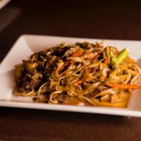 Pad See-Lew · Stir-fried rice noodles with your choice of meat, eggs and Chinese broccoli in sweet black s...