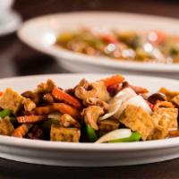 Gai Pad Med Ma-Muang · Thai style chicken stir fried with bell peppers, carrots, onions, and crispy chili in lanna ...