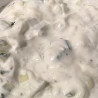 Yogurt Salad · Fresh cucumbers and mint dressed in plain yogurt with a hint of garlic.