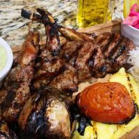 Lamb Chops (4 Pcs) · A house specialty, marinated with oregano and fresh herbs, charbroiled to a tender perfection