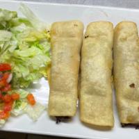 Flautas · Three chicken or beef fried rolled tacos topped with sour cream and served with a mini salad.