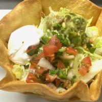 Taco Salad · A crispy bowl flour tortilla filled with beans and melted cheese your choice chicken or beef...
