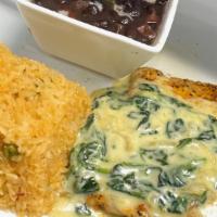 Pollo Laredo · Grilled boneless chicken topped with spinach and cheese. Served with rice and black beans.