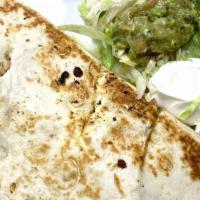 Quesadilla Tampico · A large flour tortilla stuffed with cheese and your choice of chicken or steak. Served with ...