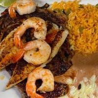 Steak Del Mar · Rib-eye steak, tilapia and shrimp. Served with guacamole salad, rice and beans.