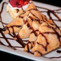Sopapillas · 6 pcs of soft mexican flatbread and golden brown dusted with cinnamon sugar whipped cream st...