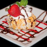 Fried Ice Cream · Fried rice crispy vanilla ice cream coats with corn flakes coconut topped with whipped cream...