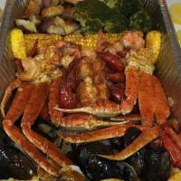 (2) Snow Crab Clusters (1 Lb), 1 Lobster Tail (5 Oz) And Shrimp (1 Lb) · Includes two side of corn, potatoes and broccoli.