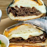 Chicago Style Beef Dip  · Sliced Roast Beef with Mozzarella Cheese on a Fresh Steak Roll. Comes With a Side of Hot Pep...