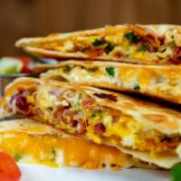 Breakfast Quesadillas-Only Offered Before 11Am · Flour tortilla stuffed with scrambled eggs and scallions, cheddar, Swiss cheese, cilantro ba...