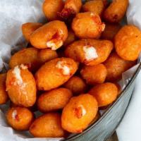 Battered Cheese Curds  · Served with Ranch for Dipping.