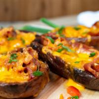Stuffed Wedges  · Stuffed with Cheddar, Bacon, Sour Cream and Chives.