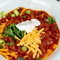 Award Winning Chili · Topped with Cheddar Cheese, Sour Cream, and Onions. Served with Fresh Baked Bread.