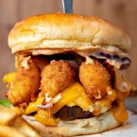Wisconsin Burger · Topped with Wisconsin Cheese Curds, Cheddar Cheese sauce, Chipotle Mayo, and french fries