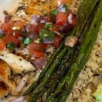 Grilled Chicken Cauliflower Rice · Seasoned chicken breast, asparagus, and cauliflower rice. Topped with Pico de Gallo.