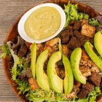 Chicken Caesar Salad · Sliced grilled chicken breast over emerald lettuce, sliced avocado, boiled egg, croutons, an...