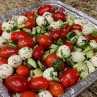 Caprese Salad · Serves 10-12 people
cherry tomatoes, zucchini, basil, olive oil and mozzarella.