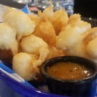 Beer Battered Cheese Curds · With spicy apricot jam.