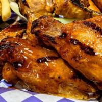 Traditional Wings  · Traditional bone in wings fried and tossed in sauce. Served with ranch or blue cheese and ch...
